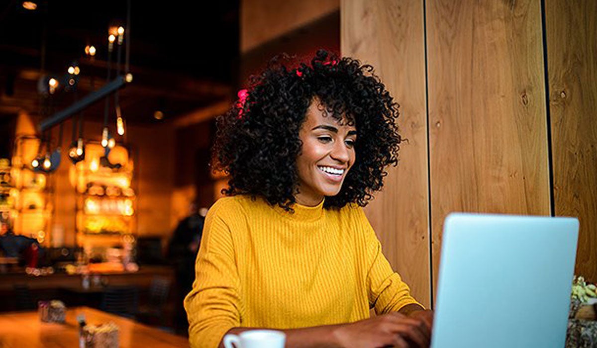 Couple car shopping on laptop